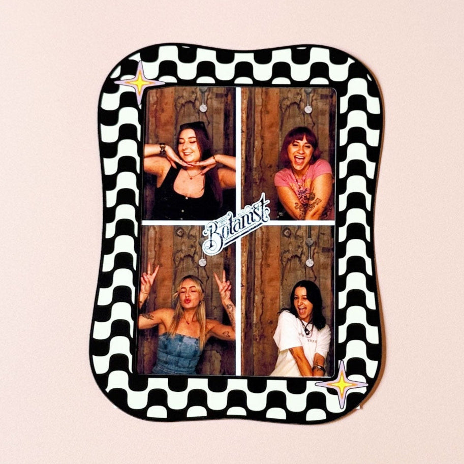 Small rectangular tray with checkered border featuring four photos of a woman on a beige background.