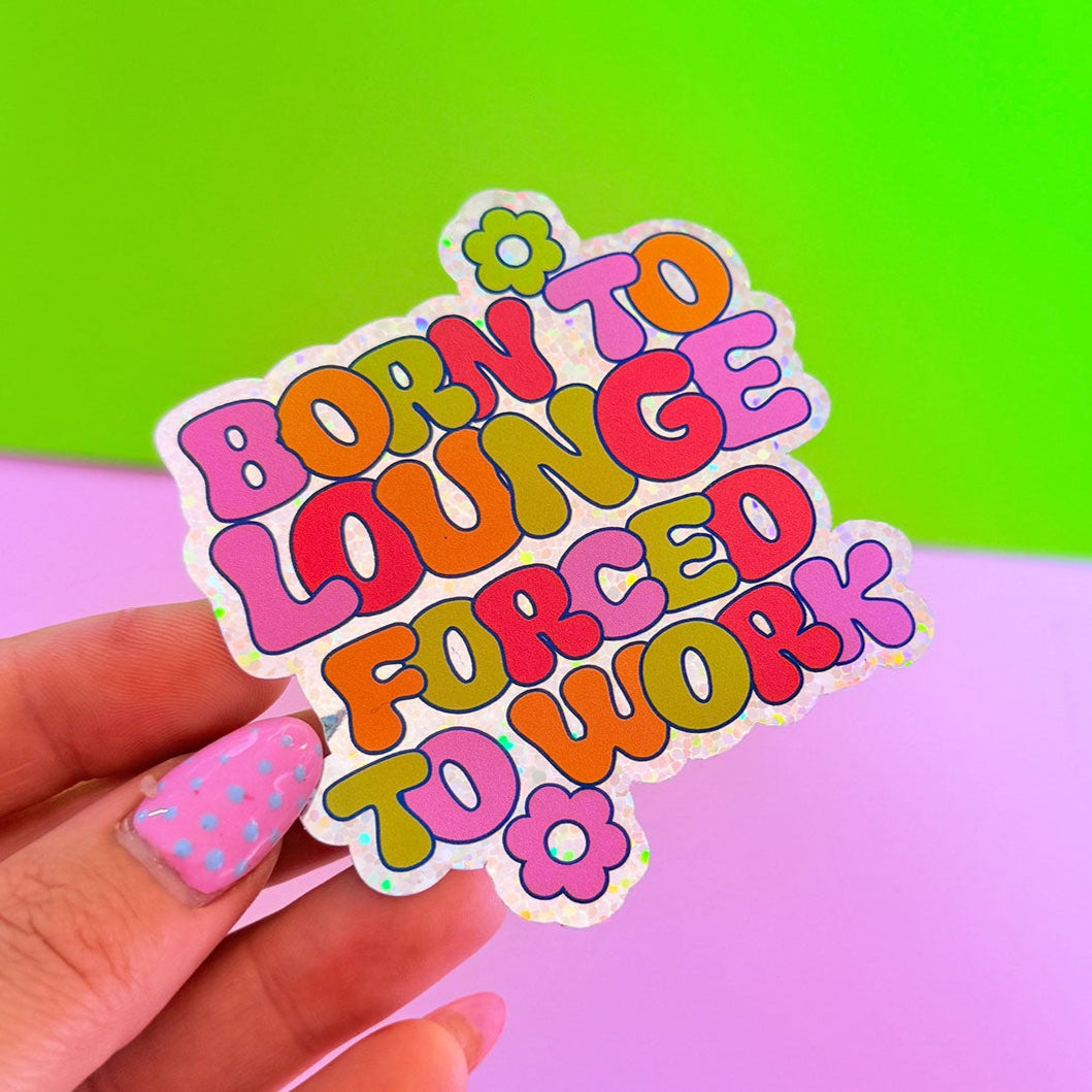 Sticker with colorful text held against a gradient background