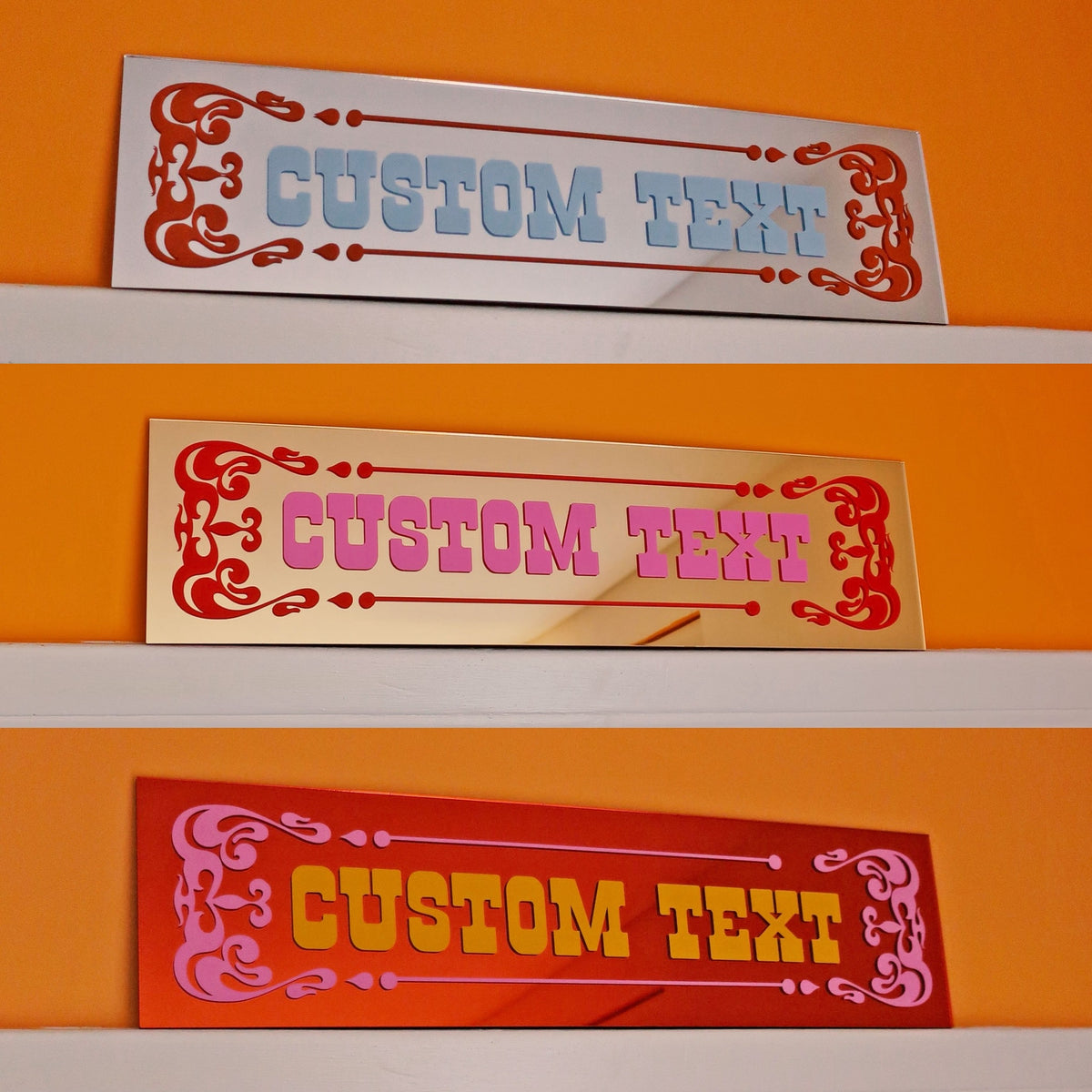 three rectangular signs with the text "CUSTOM TEXT" written on them, placed on a shelf against an orange wall.