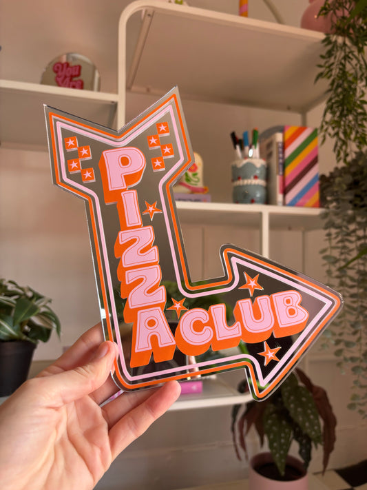 A hand is holding a large sign that says "PIZZA CLUB" in a stylized font, with an arrow pointing to the right.